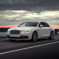 Bentley-flying-spur-white-vag-luxure-sedan-clouds-sky-evenin