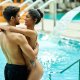 Happy-couple-love-standing-embraced-swimming-pool-spa 637285