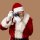 219242368-santa-claus-in-glasses-with-camera-taking-photo-on